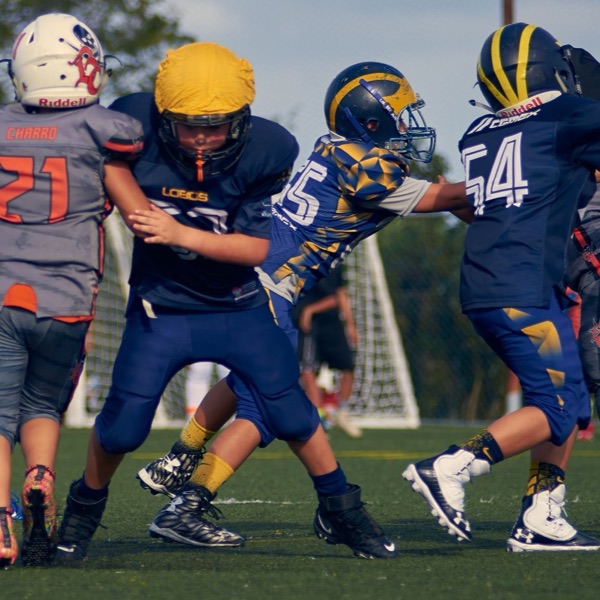 Youth football linemen colliding at the snap